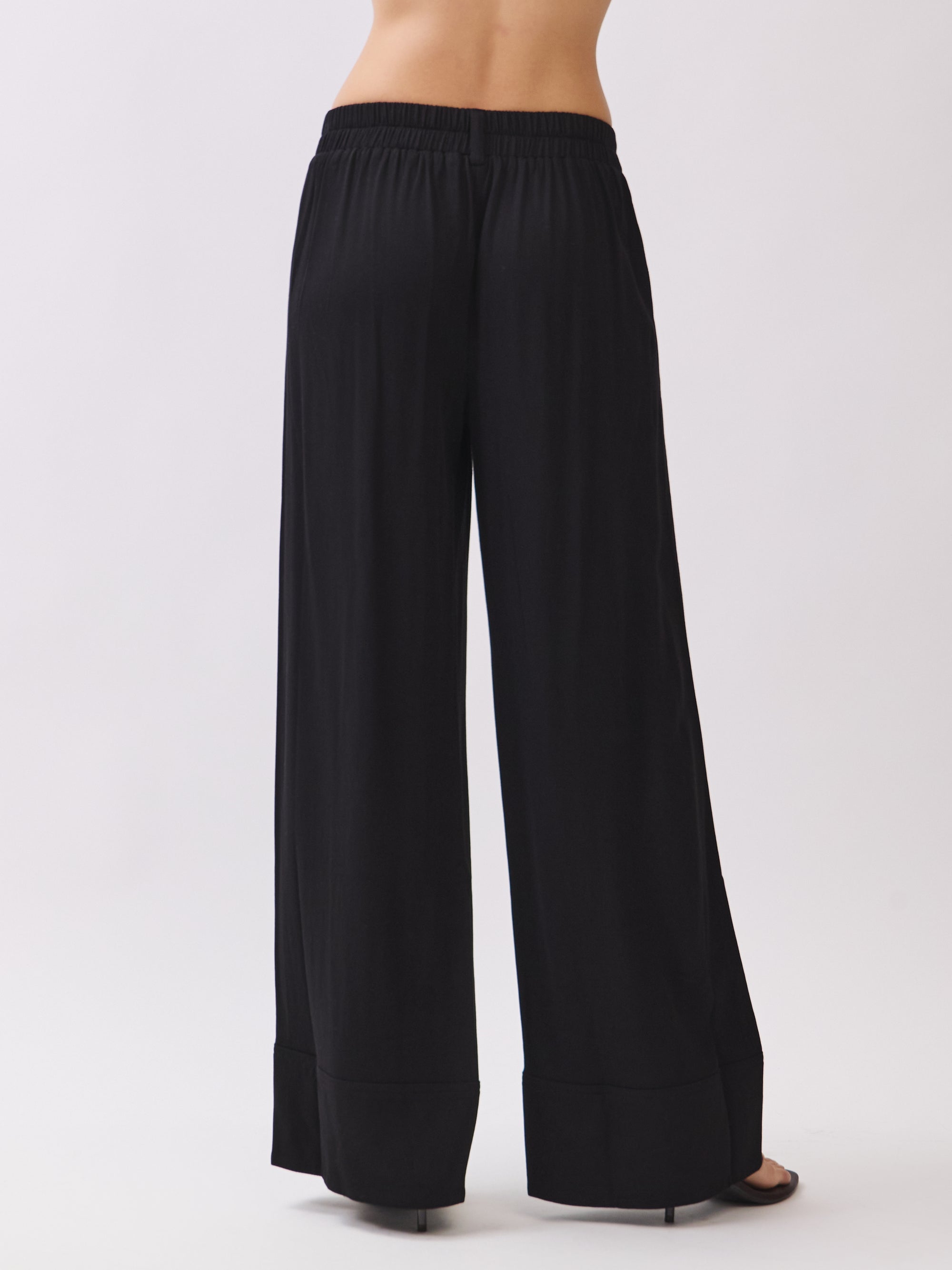 BTTRMMT Black Sophia Pants back view featuring the tailored waistband, relaxed wide-leg fit, and smooth back seams.