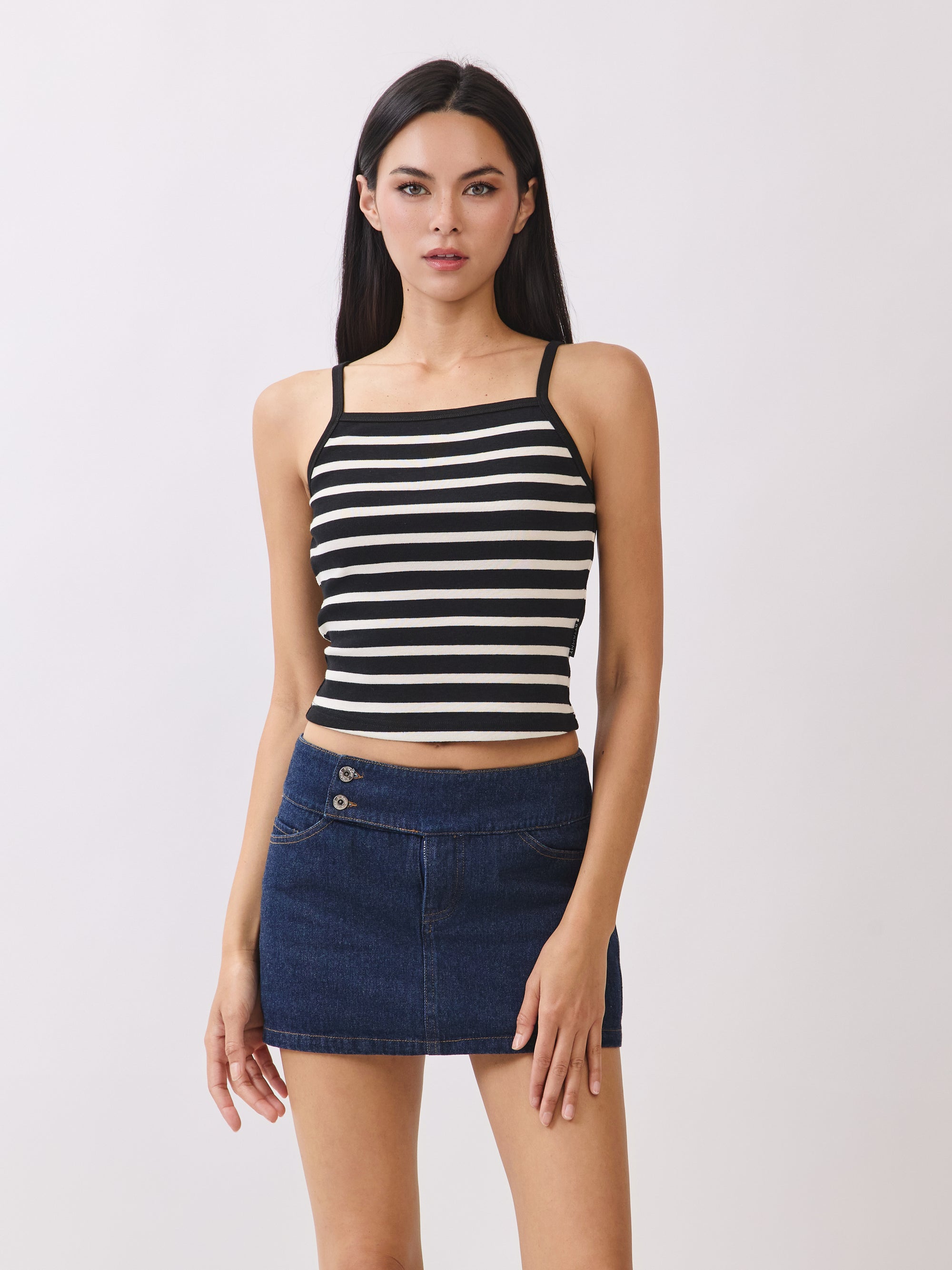 BTTRMMT Black Striped Ribbed Tank Top – cropped fit with square neckline, paired with denim mini skirt.