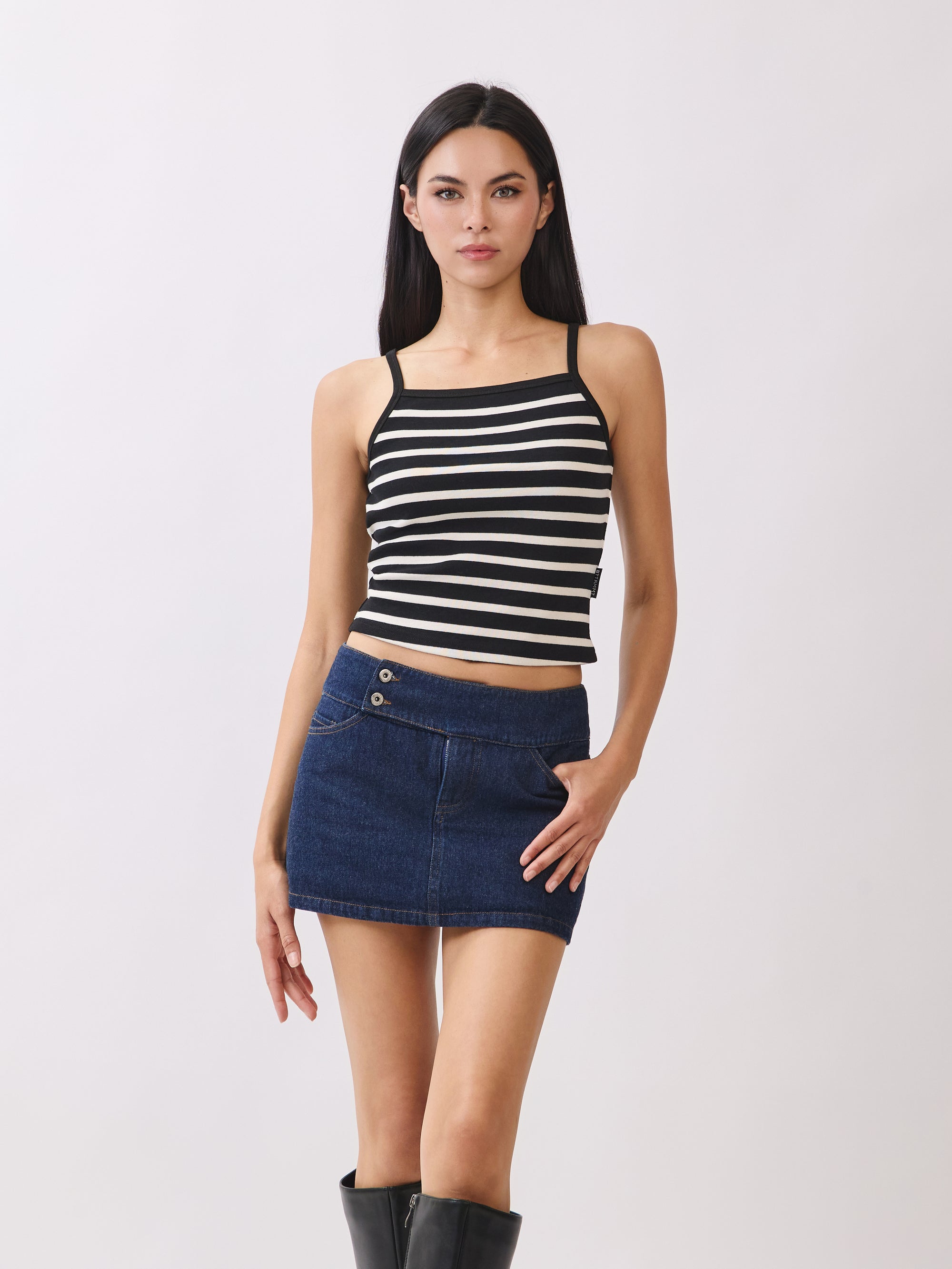 BTTRMMT Black Striped Ribbed Tank Top – fitted cropped cami paired with denim mini skirt and tall black boots.