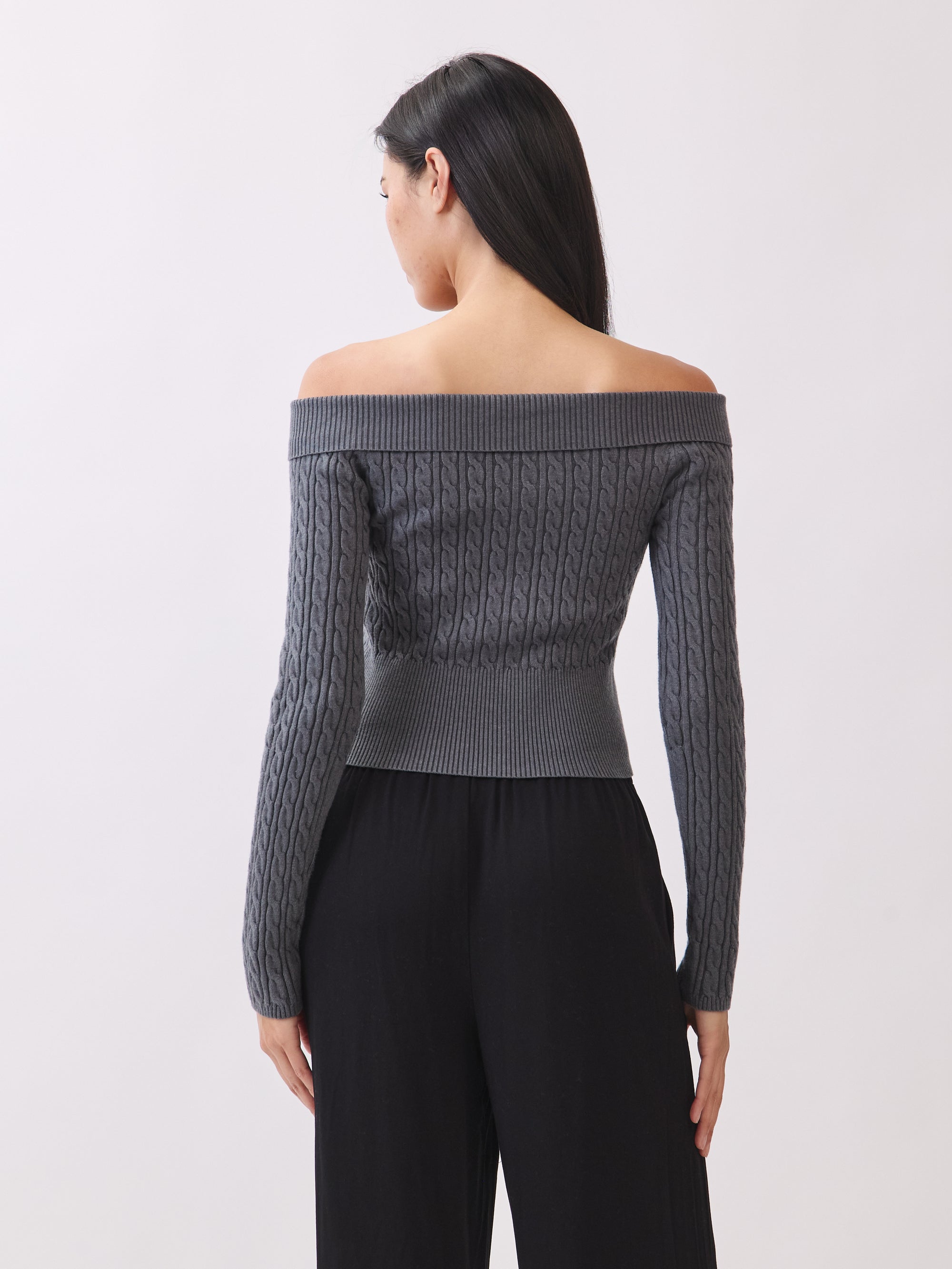 Back view of the BTTRMMT Camille Zip Knit in charcoal gray, highlighting the ribbed texture and fitted cropped back.
