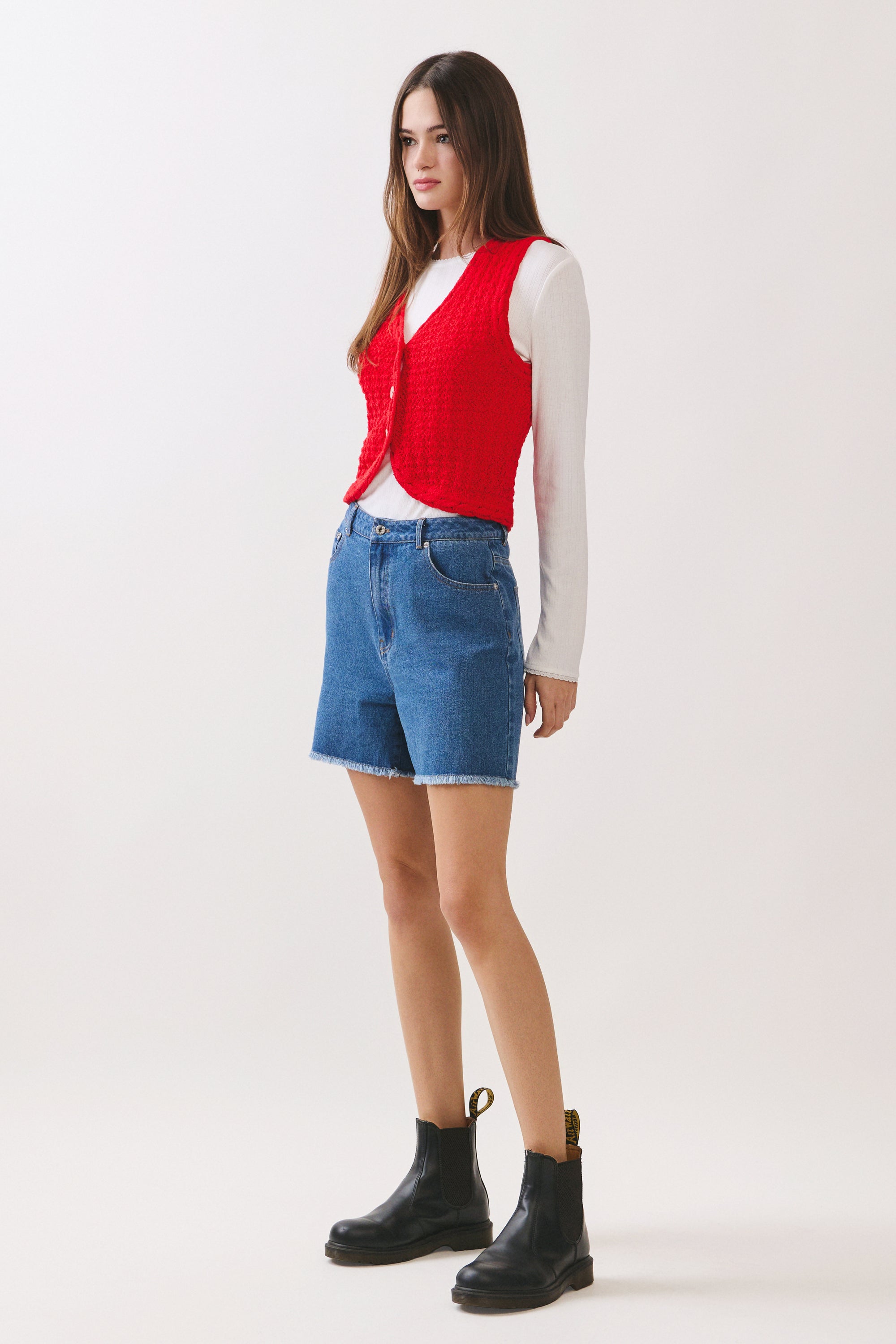 BTTRMMT Rhea Knit Vest side view highlighting cropped fit and layered styling