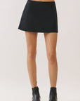 BTTRMMT Gia Essential Skort front view with clean mini silhouette and smooth structured fabric