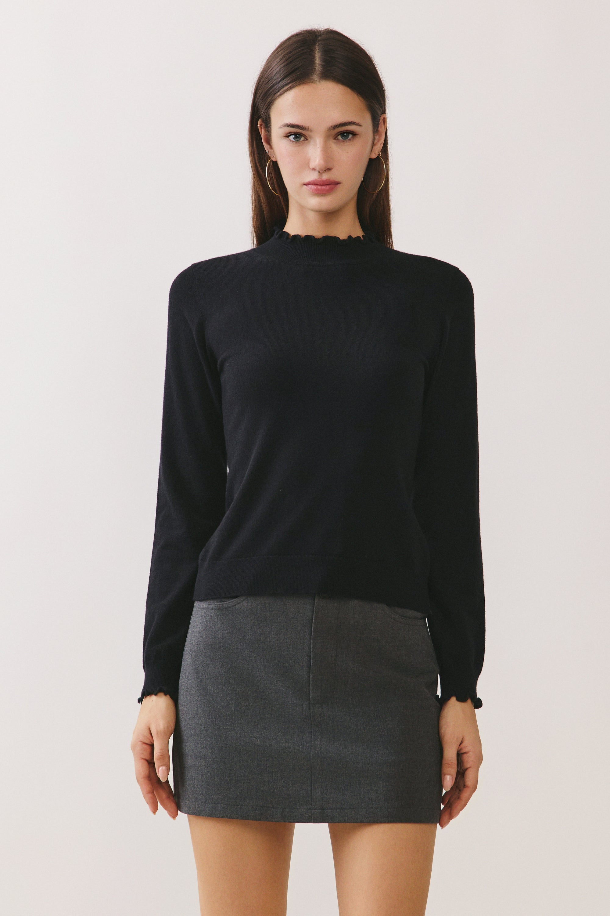 BTTRMMT Suri Ruffle Neck Knit Top front view with fitted silhouette and ruffle neckline