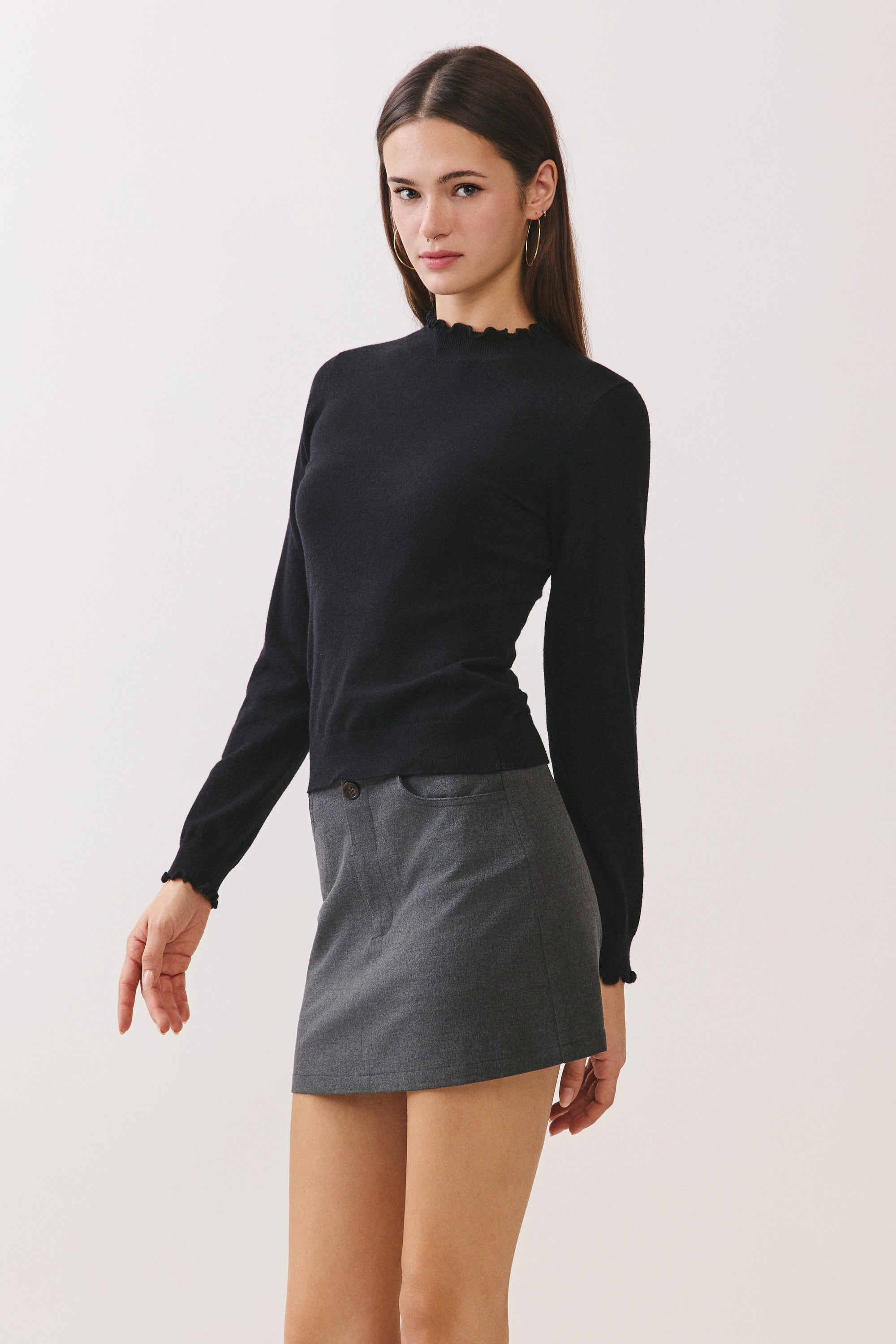 BTTRMMT Suri Ruffle Neck Knit Top side view highlighting slim fit and long sleeves