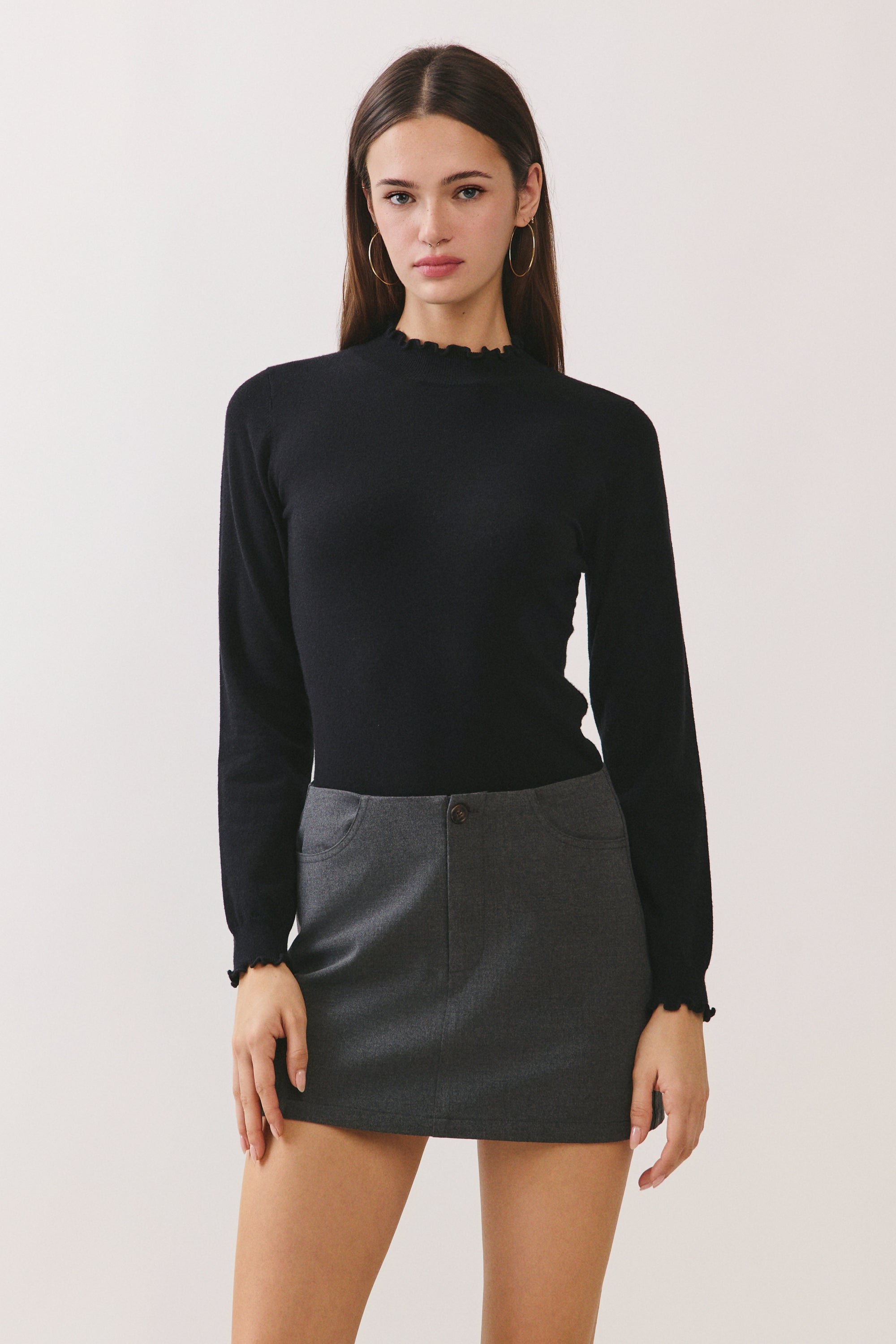 BTTRMMT Suri Ruffle Neck Knit Top front view with fitted silhouette and ruffle neckline