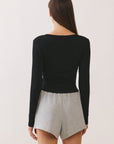 BTTRMMT Black Aubree Henley Top back view highlighting clean neckline, fitted shape, and minimalist design.