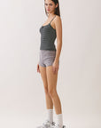 BTTRMMT Black Lina Striped Button Tank shown from side with fitted silhouette and thin shoulder straps