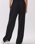Back view of BTTRMMT Black Yuna Soft Wide Leg Pants featuring a relaxed drape, drawstring waistband, and soft flowy silhouette.