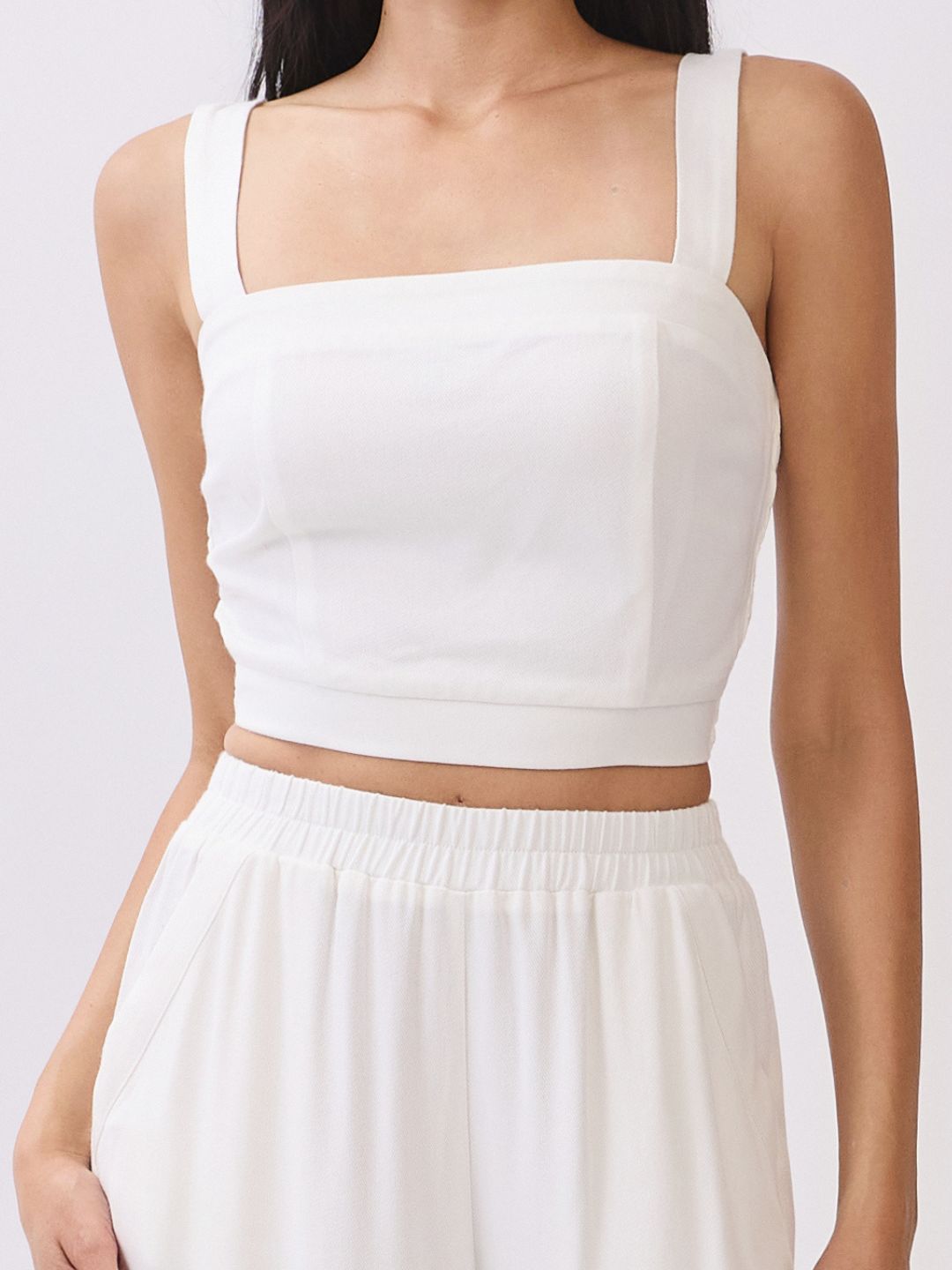 Close up view of BTTRMMT Ivory Olivyn Set showing square-back cropped top with wide straps and matching flowy wide-leg pants.