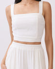Close up view of BTTRMMT Ivory Olivyn Set showing square-back cropped top with wide straps and matching flowy wide-leg pants.