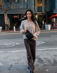 BTTRMMT Vera Faux Leather Pants styled on model in downtown Los Angeles street