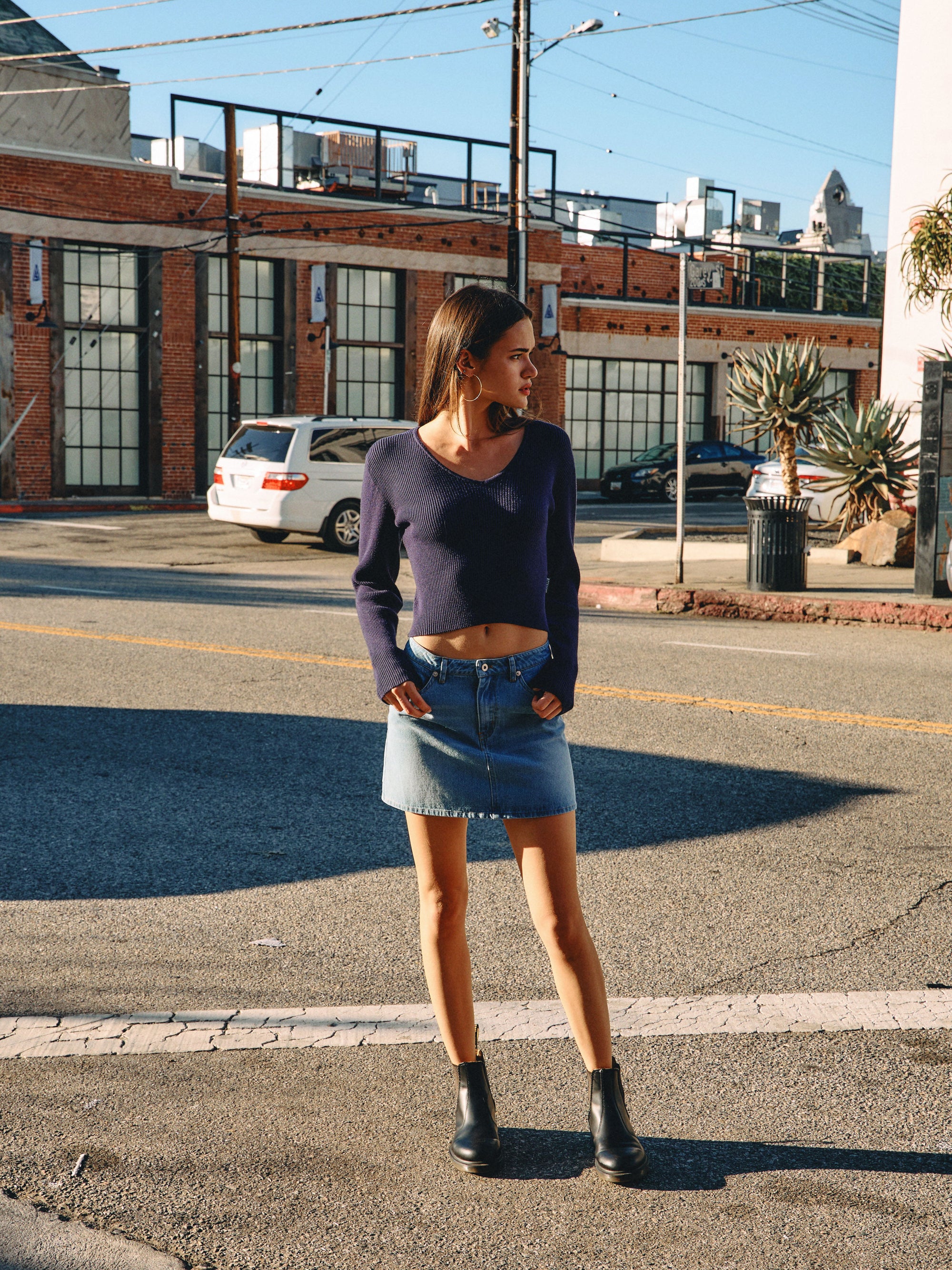 BTTRMMT Tate Everyday Denim Skirt lifestyle shot styled in downtown Los Angeles street setting
