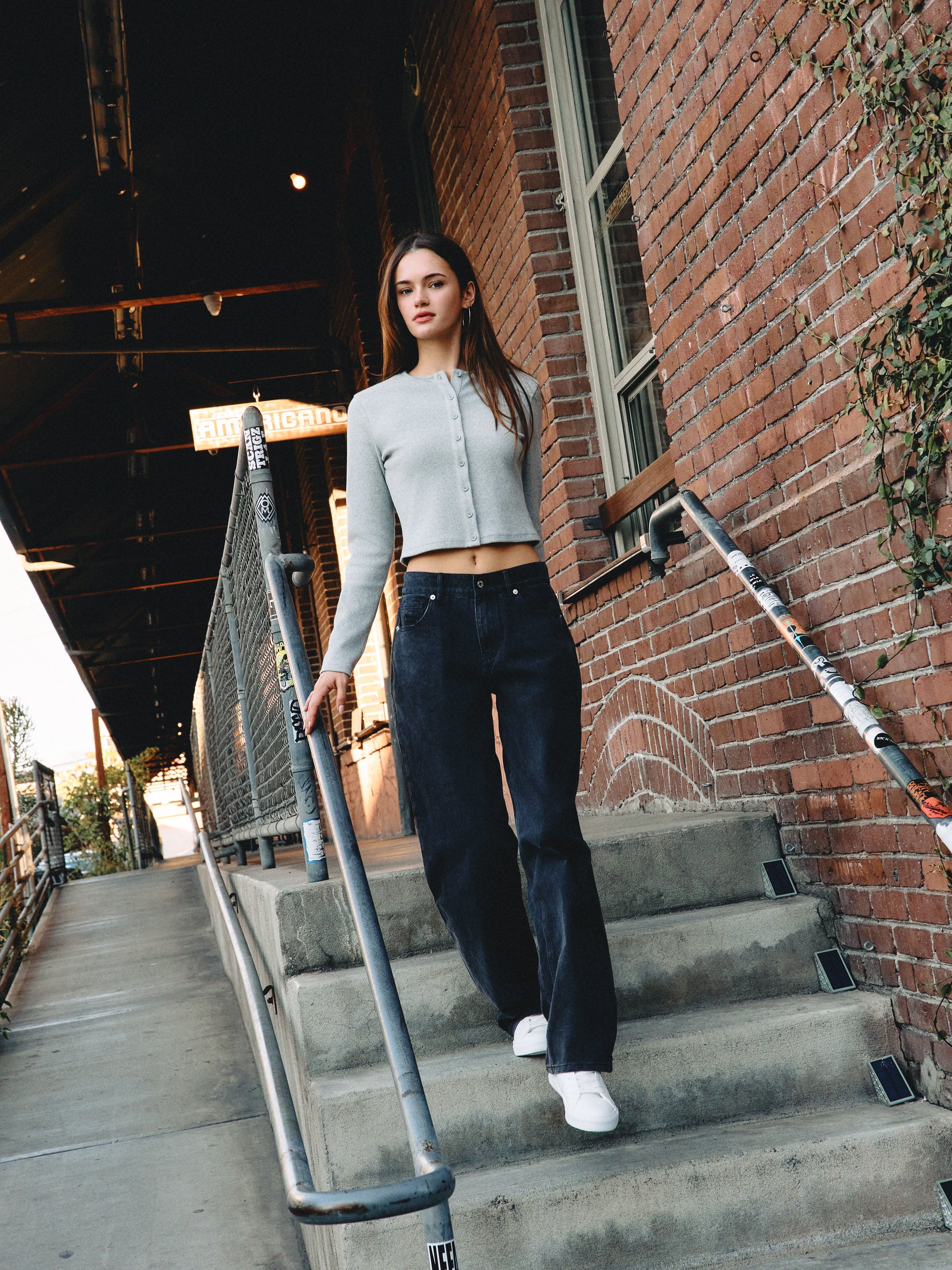 BTTRMMT Evie Mid-rise Washed Black Denim Jeans with relaxed straight-leg fit styled casually outdoors