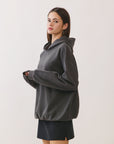BTTRMMT Reese Studded Hoodie side view highlighting oversized silhouette and stud accents