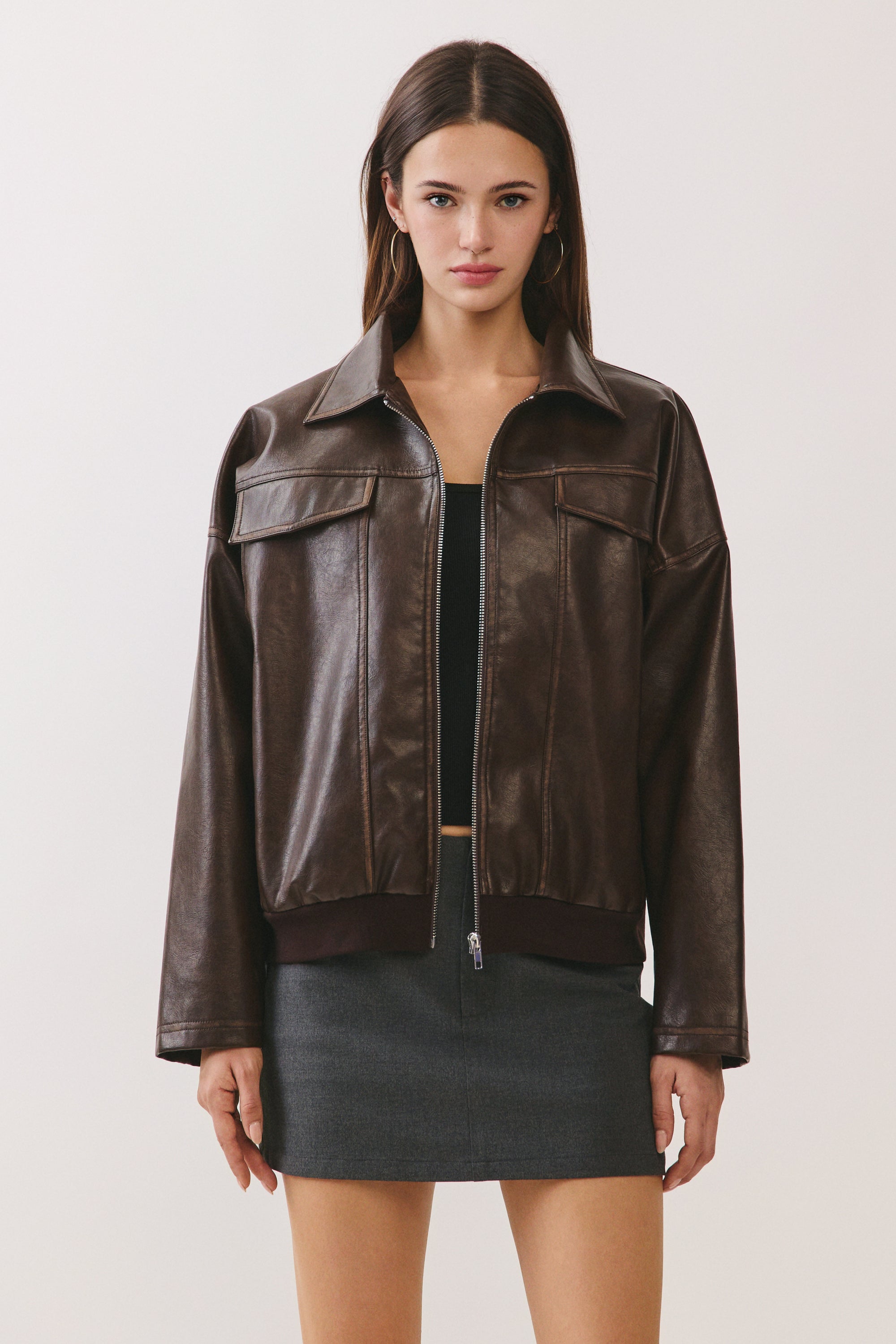 BTTRMMT Reign Faux Leather Jacket front view with oversized fit, zip front, and smooth faux leather