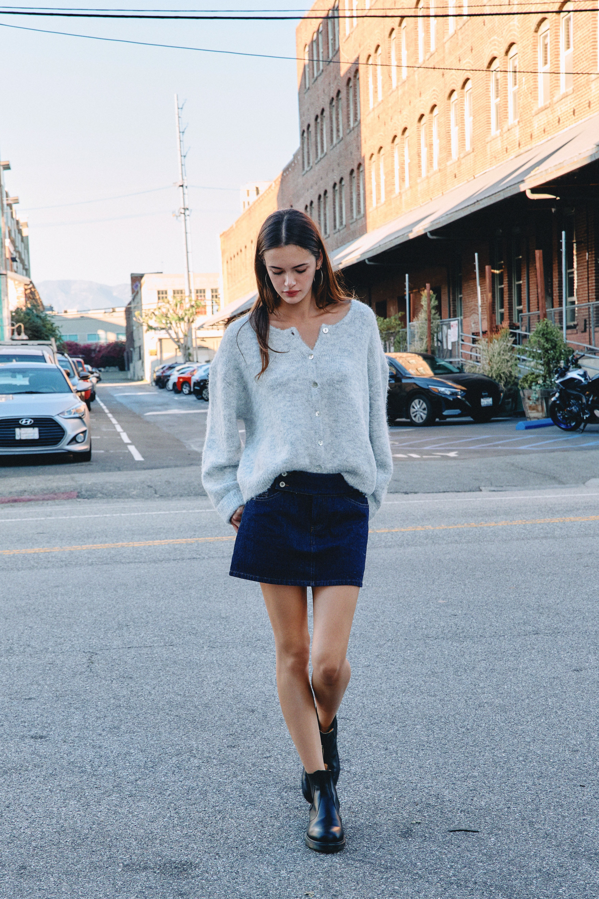 BTTRMMT Gray Millie Cardigan front view worn in downtown Los Angeles with button-front design and relaxed full-length fit