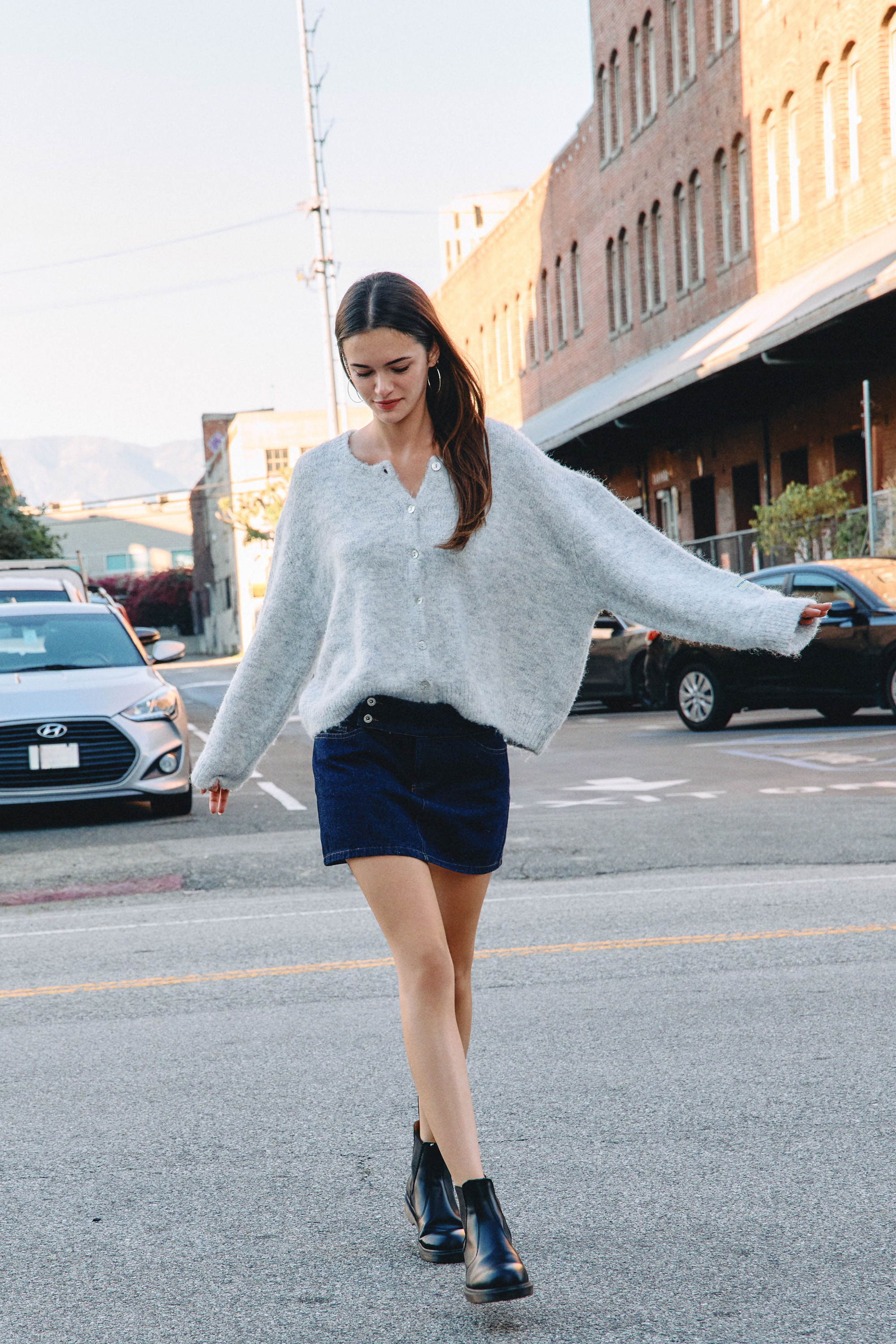 BTTRMMT Gray Millie Cardigan front view worn in downtown Los Angeles with button-front design and relaxed full-length fit