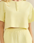 BTTRMMT Yellow Zenna Short Sleeve Top close-up of textured fabric and button neckline detail